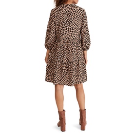 Model wearing Phase Eight Kesia Hearts Swing Dress in cream with heart print, bracelet sleeves, tiered skirt, styled with tan ankle boots