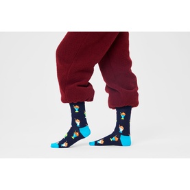 Model wearing Happy Socks Milkshake Socks in multi, navy base with turquoise heel and toe, retro milkshake print, styled with burgundy trousers