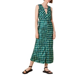 Model wearing Whistles Silk Checkerboard Midi Dress in green, sleeveless V-neck with gathered waist and front slit, styled with black sandals