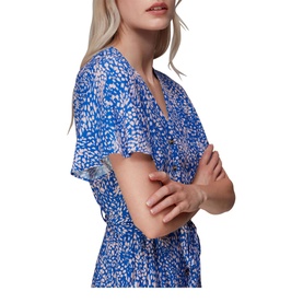 Model wearing Whistles Lively Animal Jemma Jumpsuit in blue flecked print, showing V-neck, frill short sleeves and button fastening detail