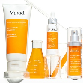 Murad Correct & Protect SPF 45 PA++++ shown with Environmental Shield Essential-C Cleanser and serum, styled with glass lab beakers