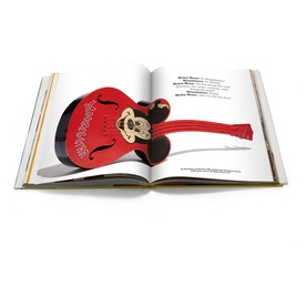 Assouline Mattel: 70 Years of Innovation and Play hardback book open to spread featuring illustrated red guitar artwork