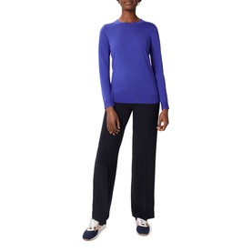 Model wearing Hobbs Penny Merino Wool Sweater in blue with crew neck and ribbed trims, styled with wide-leg black trousers
