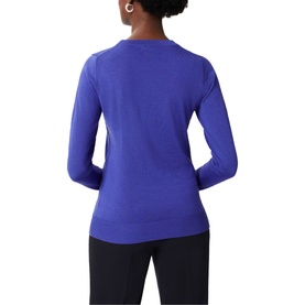 Model wearing Hobbs Penny Merino Wool Sweater in blue, rear view, crew neck, long sleeves, ribbed trims, styled with dark trousers