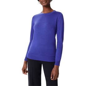 Model wearing Hobbs Penny Merino Wool Sweater in blue, crew neck with long sleeves and ribbed trims, styled with black trousers