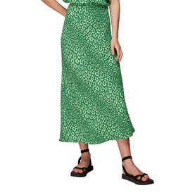 Model wearing Whistles Leopard Petals Bias Cut Skirt in green leopard print with flared hem, styled with black strappy sandals