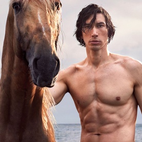 Burberry Hero Eau de Parfum campaign image featuring a shirtless man beside a horse on a coastal backdrop