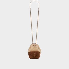 Saint Laurent Joe Shearling and Suede Mini Bucket Bag in brown, with cream shearling upper, bronze YSL logo, and long leather shoulder strap