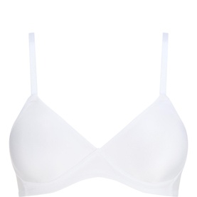 Triumph Soft Sensation Padded Bra in white, wireless full cup style with slim adjustable straps and smooth padded cups