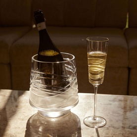 Waterford Aran Mastercraft Ice Bucket 2L in clear crystal with crisscross cut detailing, styled with a champagne flute and bottle