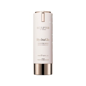 Sculpted by Aimee HydraGlo Serum in a pale pink pump bottle with gold cap and branding detail.