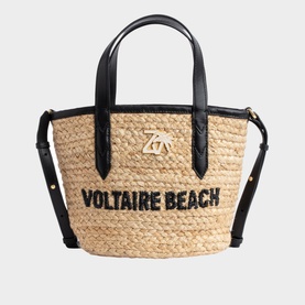 Zadig Le Baby Beach Bag Tote in natural raffia with black leather handles, adjustable strap, and Voltaire Beach embroidered lettering