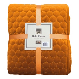 Scatterbox Halo Throw in Pumpkin orange, 140x240cm, folded to show embossed circle pattern on soft velvet fabric