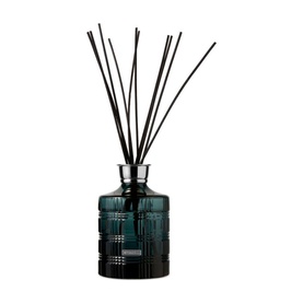 Rituals Round Bottle Petrol reed diffuser in blue tinted glass with black fragrance sticks, faceted cylindrical vessel with silver collar
