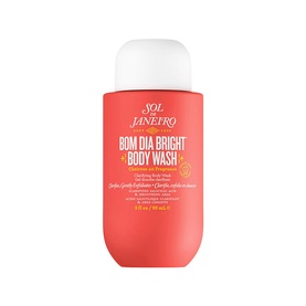 Sol De Janeiro Bom Dia Bright Body Wash in coral-pink travel-size bottle with white cap