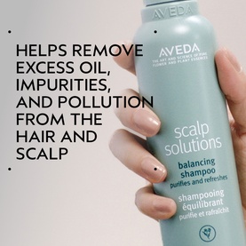 Aveda Scalp Solutions Balancing Shampoo 50ml teal bottle held in hand, removes excess oil, impurities and pollution from hair and scalp
