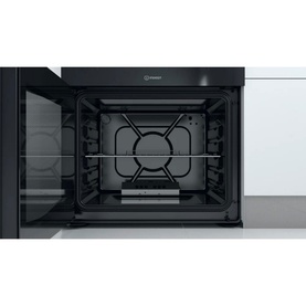 Indesit 60cm white gas freestanding double cooker, interior view showing gas burner and oven cavity with wire shelves