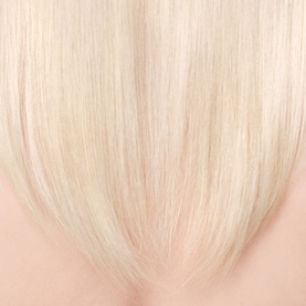 Sol De Janeiro Brazilian Joia Strengthening + Smoothing Shampoo result shown on sleek, platinum blonde hair