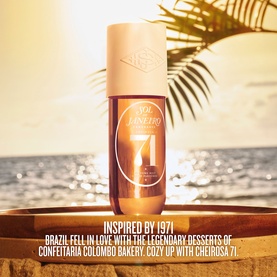 Sol de Janeiro Brazilian Crush Cheirosa 71 Perfume Mist body spray on a wooden dish with a beach sunset backdrop.