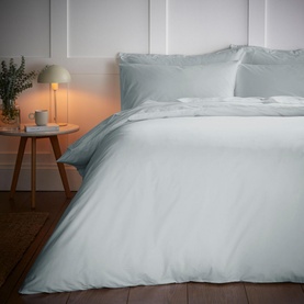 Bianca 200 Thread Count Cooling Tencel Duvet Set in Silver, shown on a made bed with matching pillowcases in a softly lit bedroom