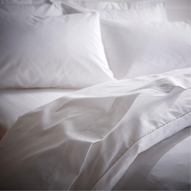 Bianca 200 Thread Count Cooling Tencel Duvet Set in white, shown styled on a bed with matching pillowcases, crisp smooth finish