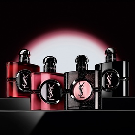 YSL Black Opium Le Parfum collection displayed in four bottles, featuring red, black glitter and pink glitter variants with signature YSL logo clasp