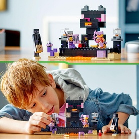 Child playing with Lego Minecraft The End Arena set, 252-piece multicoloured building toy featuring Enderman and battle scene figures
