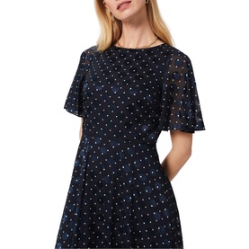 Model wearing Hobbs Ciera Spot Print Midi Dress in blue with polka dot pattern, short flutter sleeves and round neckline