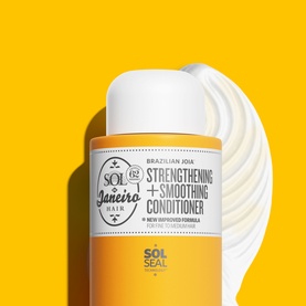 Sol De Janeiro Brazilian Joia Strengthening + Smoothing Conditioner in yellow bottle with creamy texture detail on yellow background