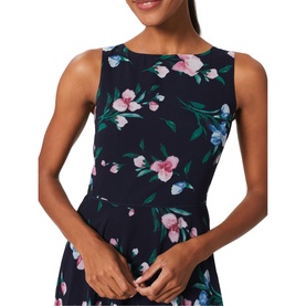 Model wearing Hobbs Carly Floral Dress in blue, sleeveless with round neck and pink floral print on navy, cinched waist visible