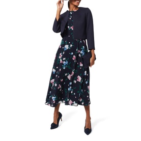 Model wearing Hobbs Carly Floral Dress in blue, midi length with cinched waist and floral print skirt, styled with navy heels