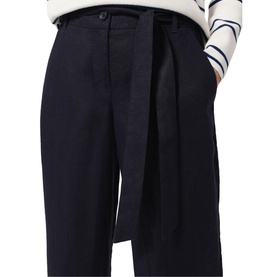 Model wearing Hobbs Jacqui Wide Leg Trousers in navy blue linen, high waist, tie belt detail, styled with a stripe top