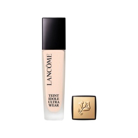 Lanc&ocirc;me Teint Idole Ultra Wear Foundation in a tall glass bottle with black cap, shown with gold compact lid