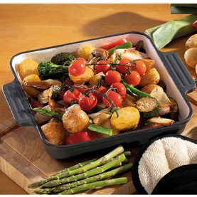 Hairy Bikers Enamelled Cast Iron 23cm Square Grey Dish filled with roasted vegetables including tomatoes, potatoes and broccoli on a wooden board