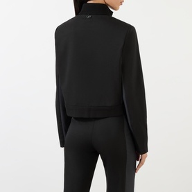 Model wearing Diesel Gauri Short Wool-Blend Zip-Through Jacket in black, rear view, showing stand-up collar and logo detail