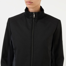 Model wearing Diesel Gauri Short Wool-Blend Zip-Through Jacket in black, showing stand-up collar and zip-through fastening at close range