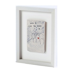 Sarah McKenna Home Is Where The Heart Is Wall Art, ceramic plaque with house motifs and red heart detail in white wooden frame
