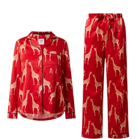 Chelsea Peers Giraffe Satin Pyjama Set in red, featuring allover giraffe print, notched lapel shirt and wide-leg trousers with elasticated waist