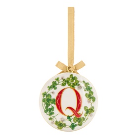 White ceramic Christmas bauble with green clover wreath design, red letter Q monogram, and gold ribbon hanger with bow