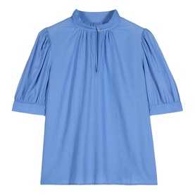 Bash Tyler Top in blue with short balloon sleeves, stand-up collar with tie detail, and pintuck pleats. 100% cotton