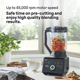 Braun SHS blender in black with transparent jug containing blended ingredients, styled on kitchen windowsill with plants and bowls nearby
