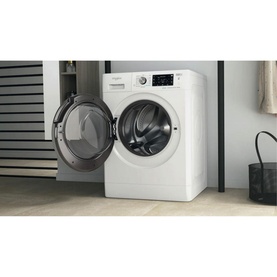 Whirlpool Black Line Freshcare 10Kg 1400 Spin washing machine in white, door open, shown in a laundry room setting