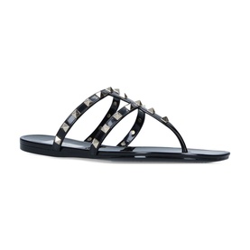 Valentino Rockstud Thong Sandals in black synthetic with triple studded straps, toe post, and flat sole