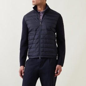 Model wearing Moncler Padded Quilted Zip Cardigan in navy, with quilted front panel, knitted sleeves