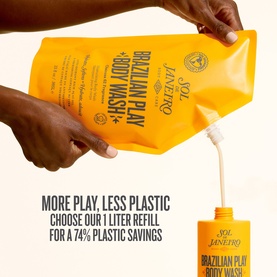 Sol De Janeiro Brazilian Play Body Wash 1 litre refill pouch being poured into a standard bottle, highlighting 74% plastic savings.
