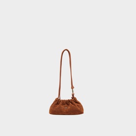 Bash June Suede Shoulder Bag in brown with ruched drawstring top, slim shoulder strap, and gold-toned hardware