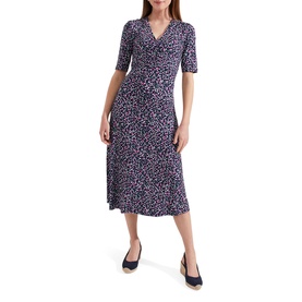 Model wearing Hobbs Frankie Printed V-Neck Midi Dress in blue animal print with ruched detail and short sleeves, styled with navy heels