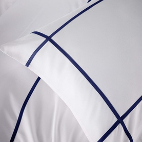Karla Bree 400 Thread Count Criss Cross Duvet Set in white with navy embroidered cross-stitch border detail, close-up view