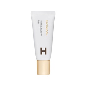 Hourglass Veil Hydrating Skin Tint foundation in white tube with gold cap, 35ml