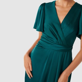 Model wearing Forever New Estelle Satin Flutter Sleeve Midi Dress in green, showing wrap-style front, cinched waist, and flutter sleeves